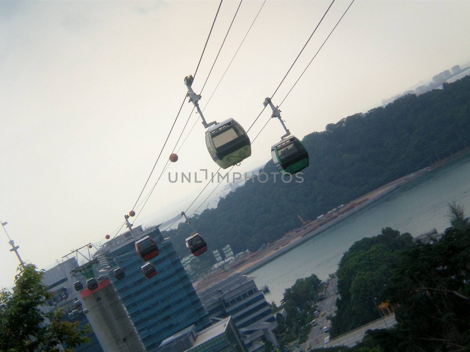 String of cable cars in singapore, shot taken from mount faber