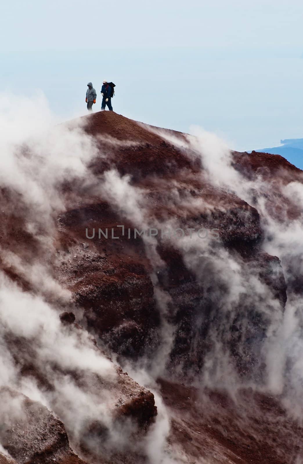 Tourists on the top of volcano. Kamchatka