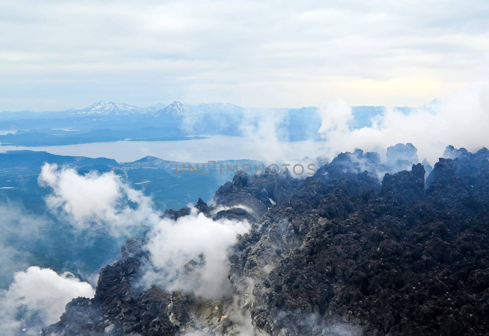 View at the Pacific ocean with of the volcano. Kamchatka. by nikolpetr