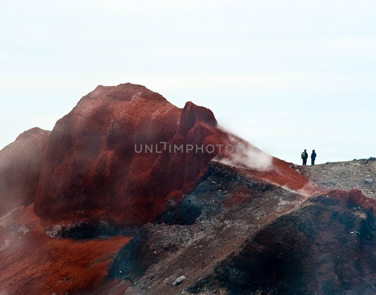 Tourists on the top of volcano. Kamchatka