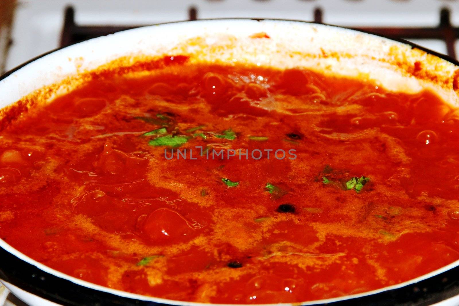 Borsch is in a pan. Red seething  Russian soup.