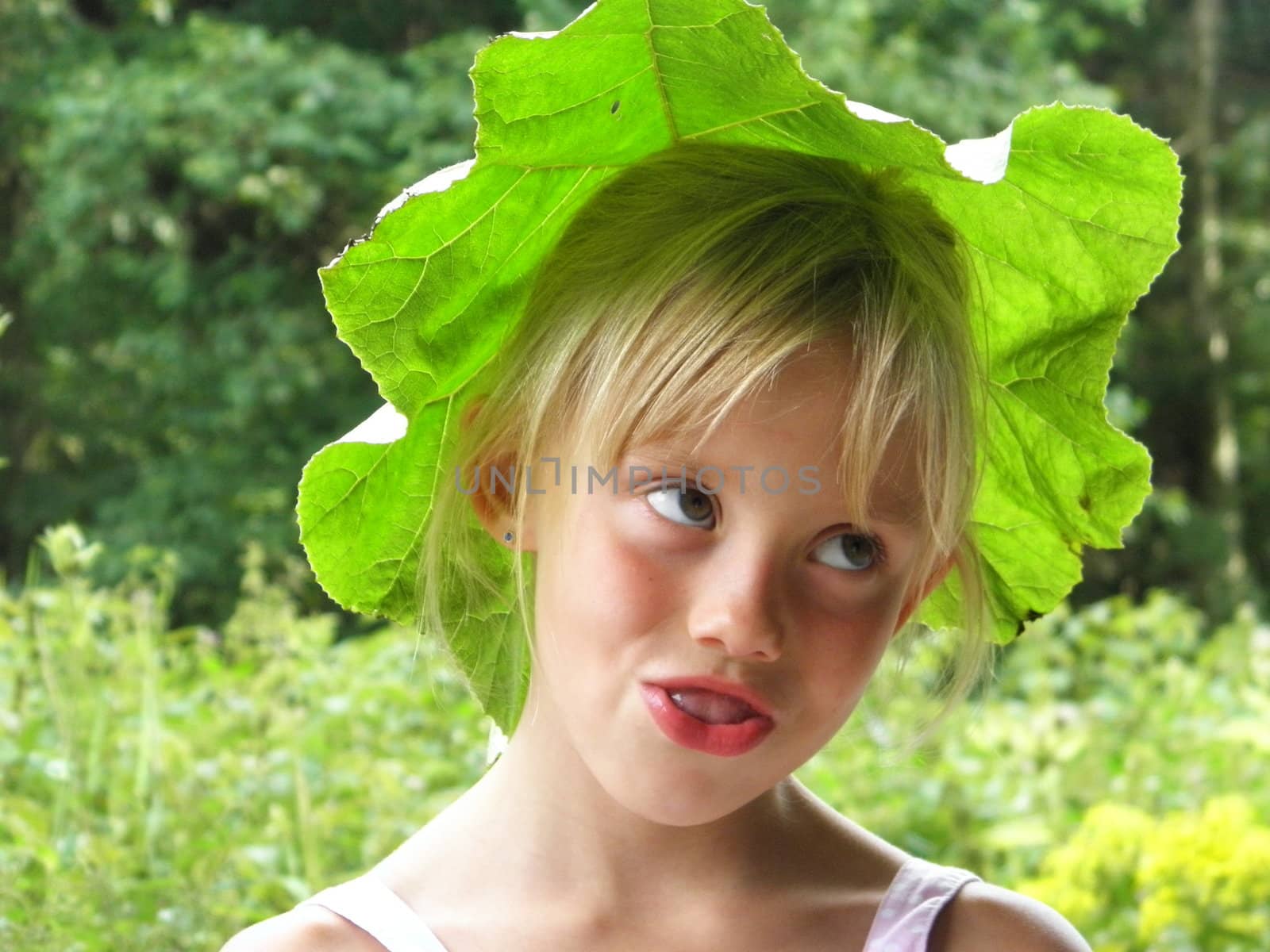 Photo of a blonde girl with a Green Hat from a sheet