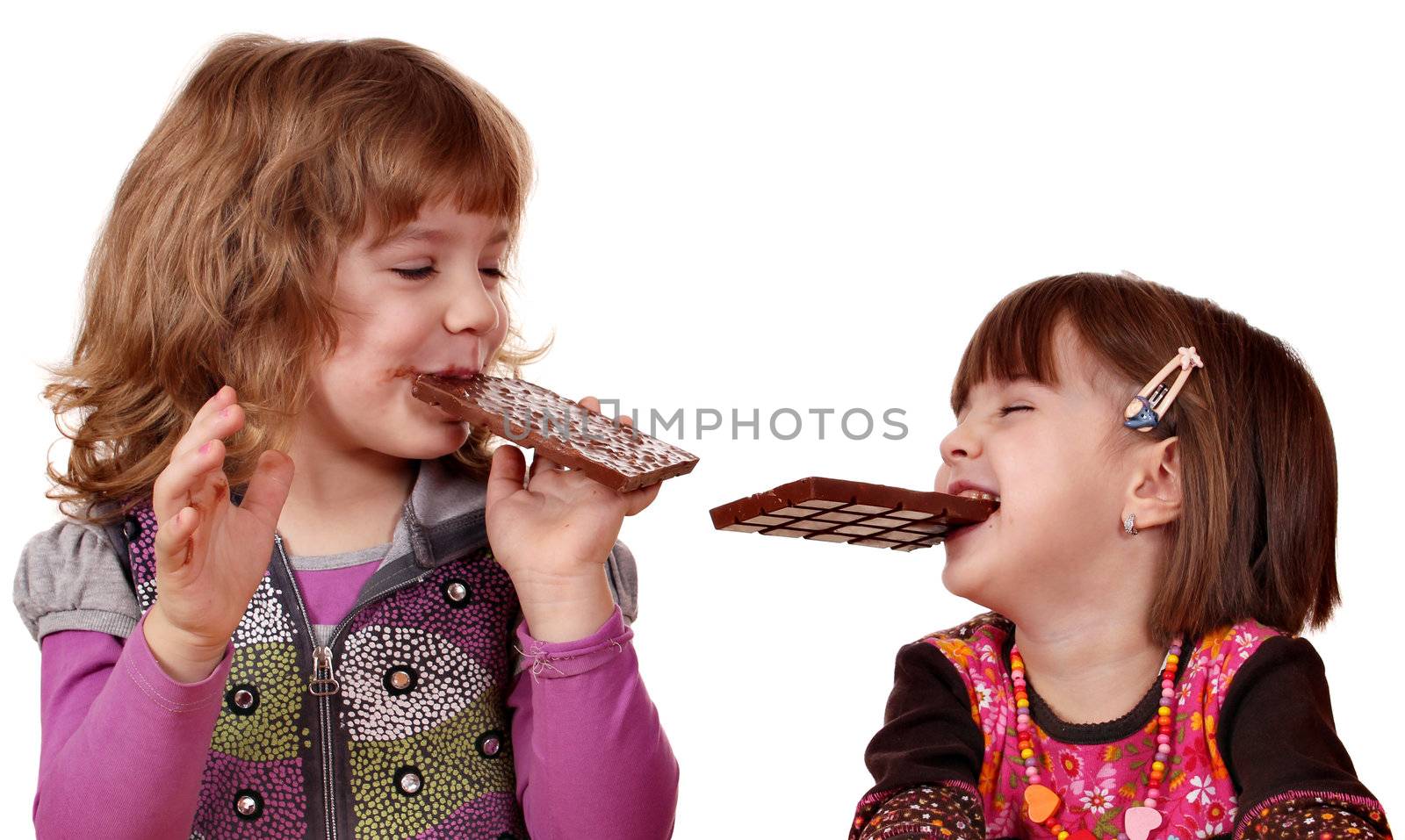 two little girls eating chocolate by goce