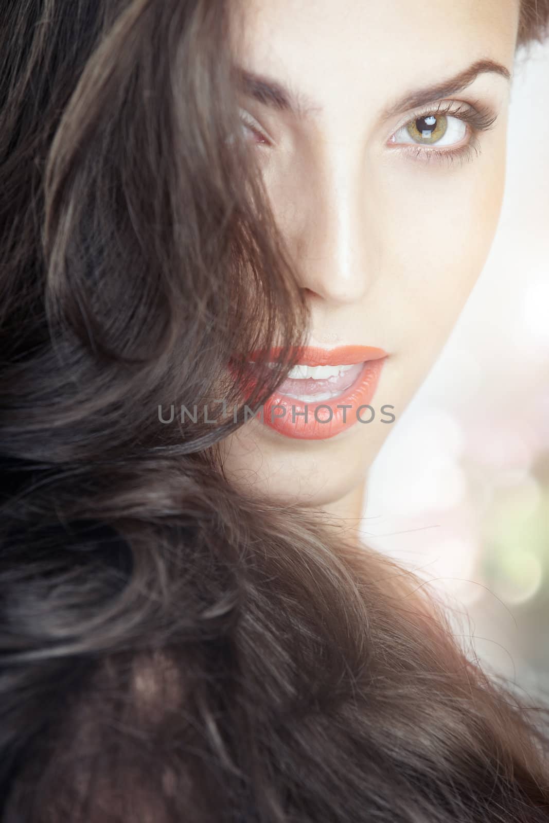 Gorgeous smiling lady on a bokeh background