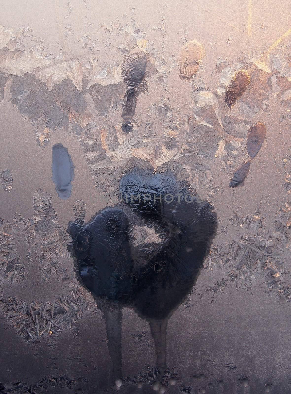 Handprint on ice window, sign desires spring