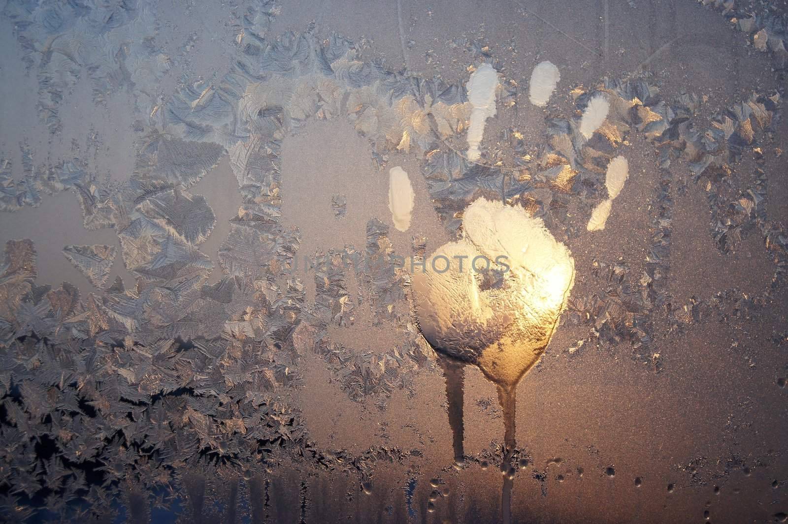 Handprint on ice window, sign desires spring
