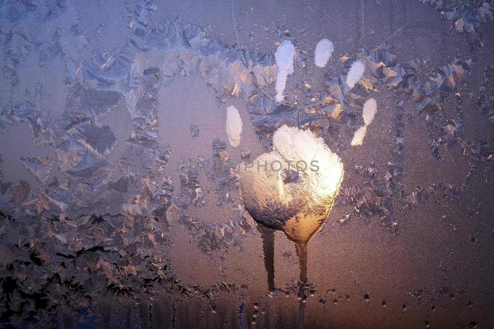 Handprint on ice window, sign desires spring
