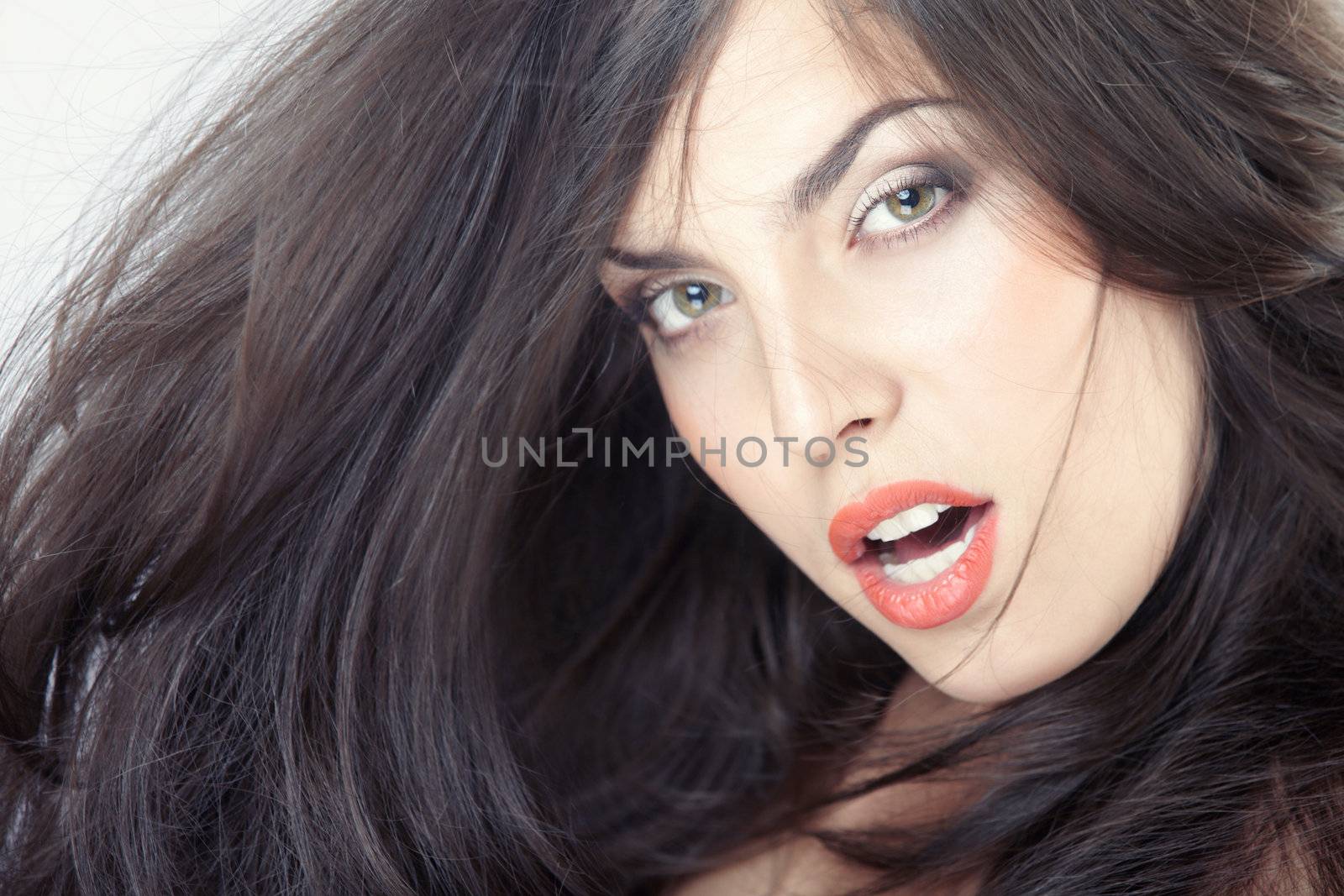 Beautiful lady with perfect makeup and blown hairs. Studio photo