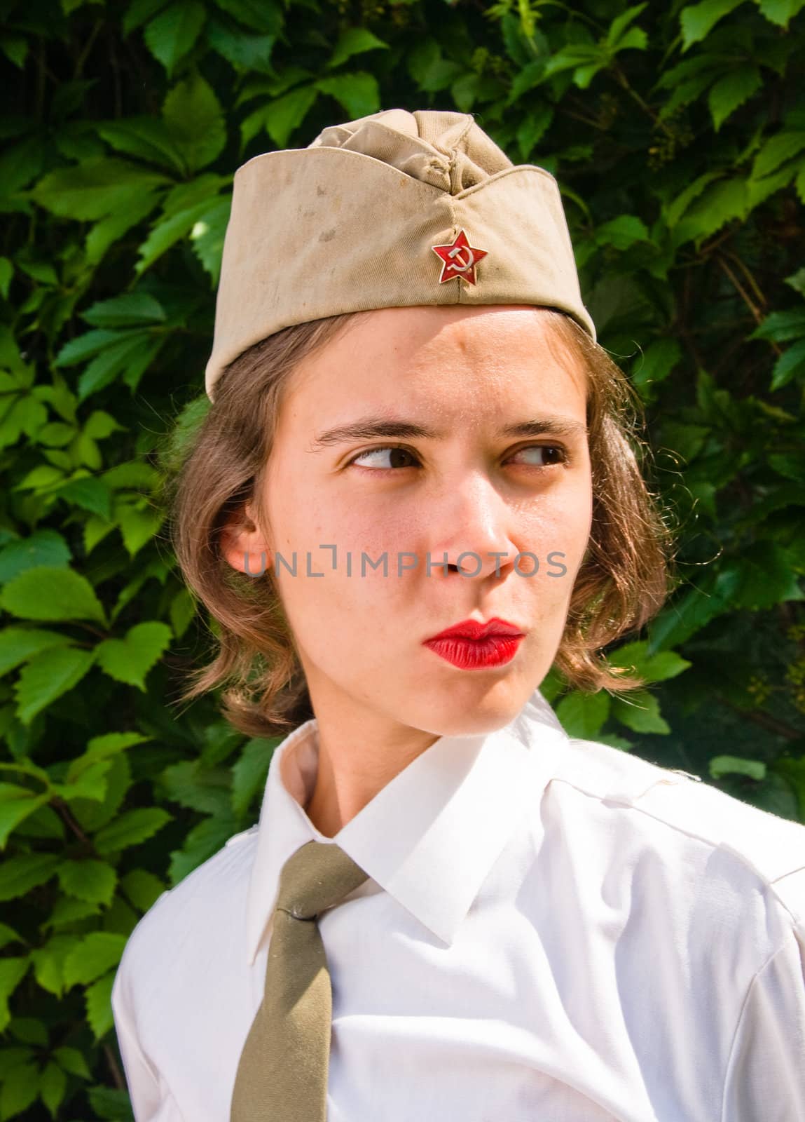 Beautiful girl wearing a soviet soldier cap