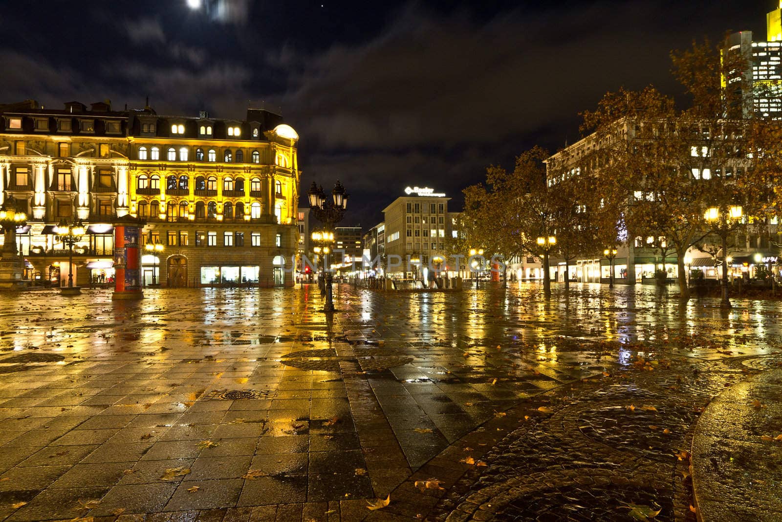 Reflection of buildings on a wet concrete floor in Frankfurt Germany