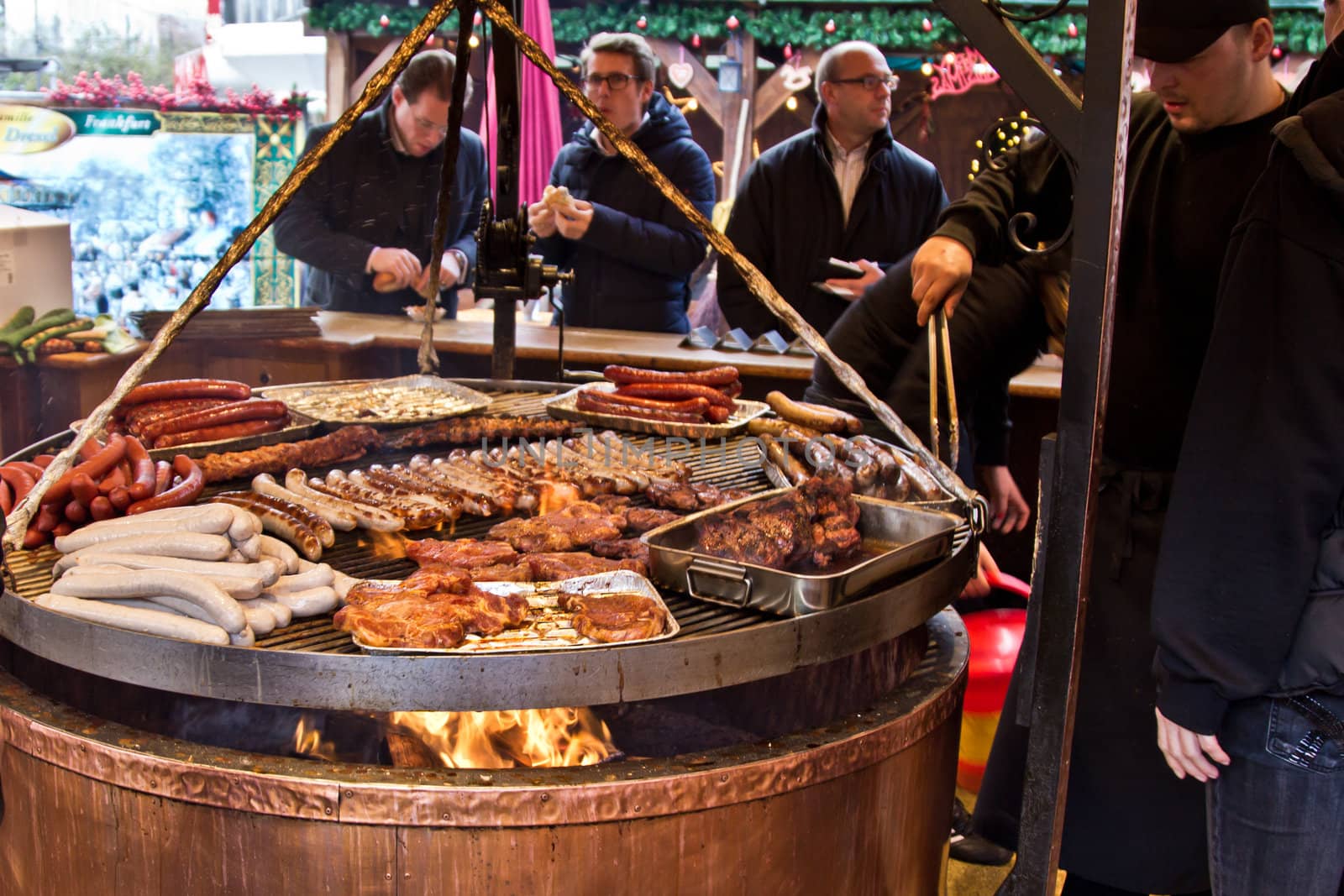 People cooking frankfurters in Frankfurt Germany