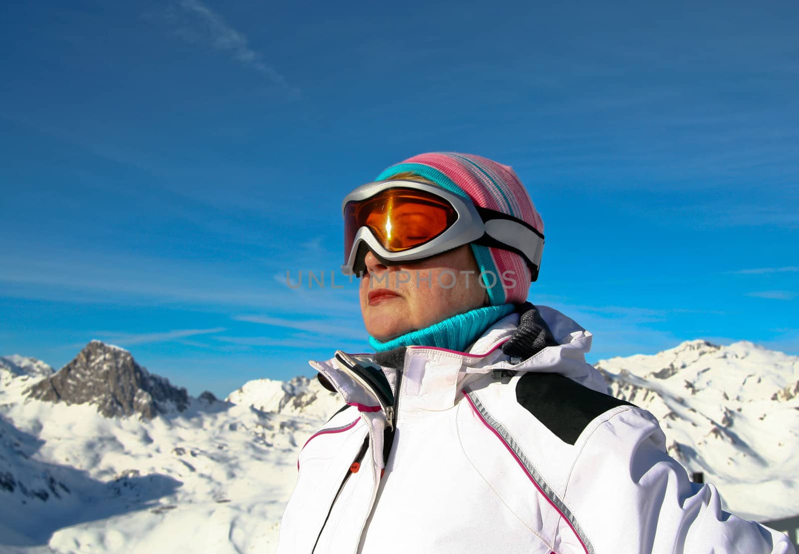 The woman meditating at the view winter mountain