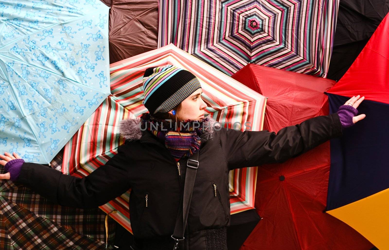 The girl on the background of colorful umbrellas