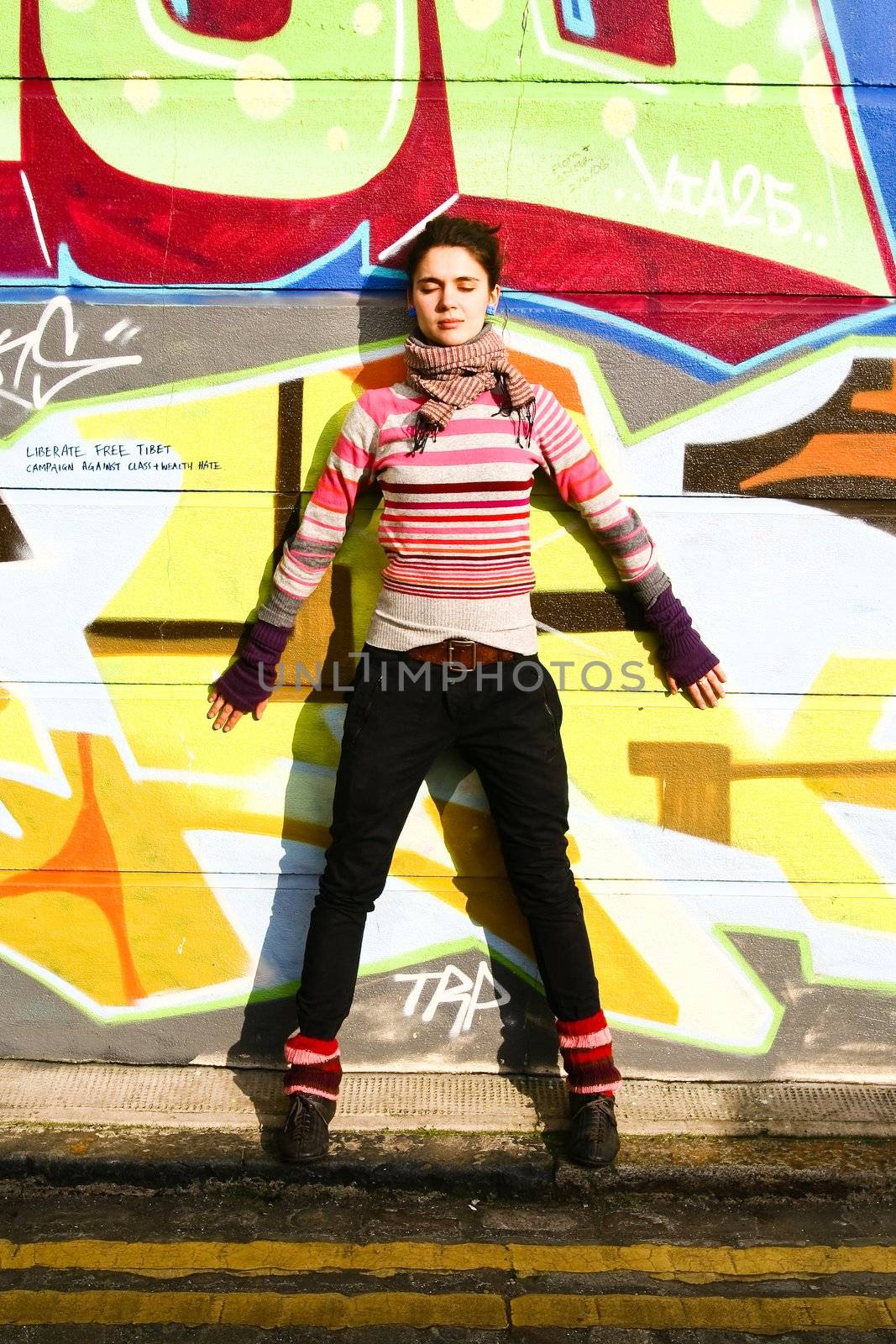 Young woman with a graffiti background