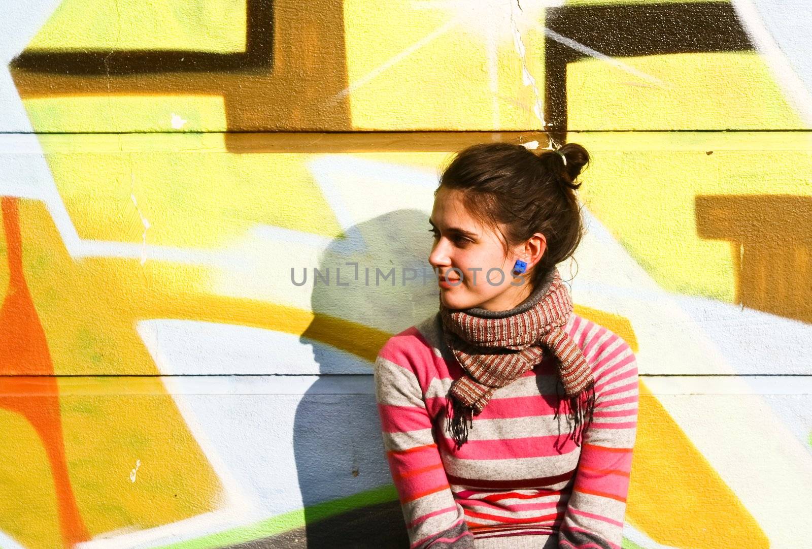 Young woman with a graffiti background by nikolpetr