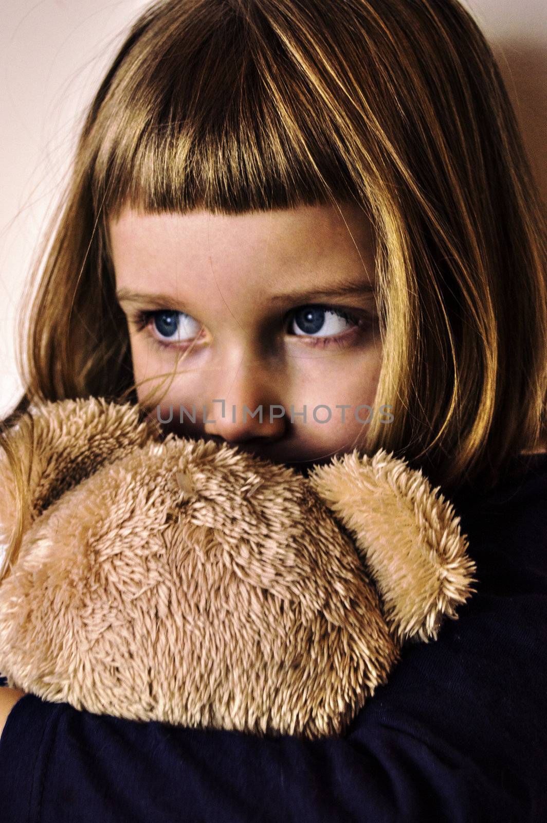 girl is holding her friend teddy bear