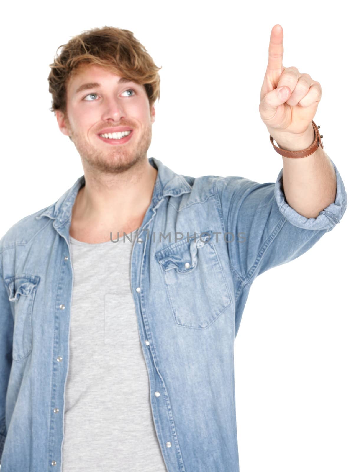 Young man pressing / pushing button isolated on white background. Young handsome smiling happy casual caucasian male in his 20s.