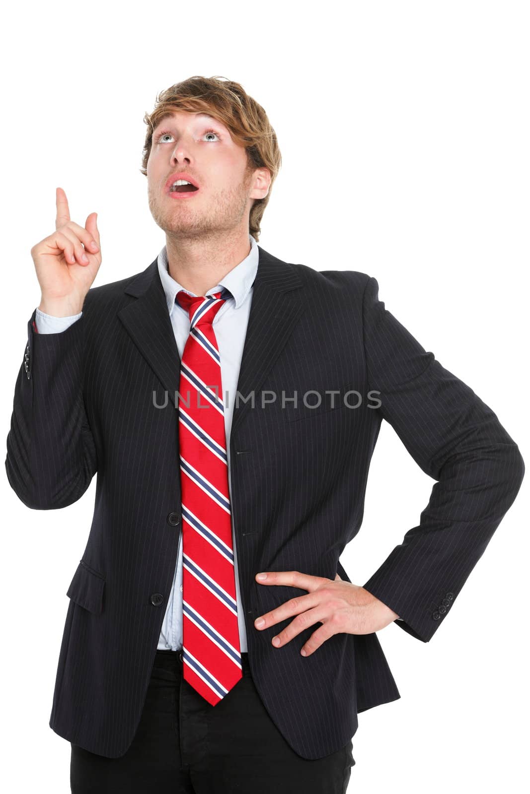 Businessman having an idea - eureka. Thinking young business man pointing up in suit isolated on white background.