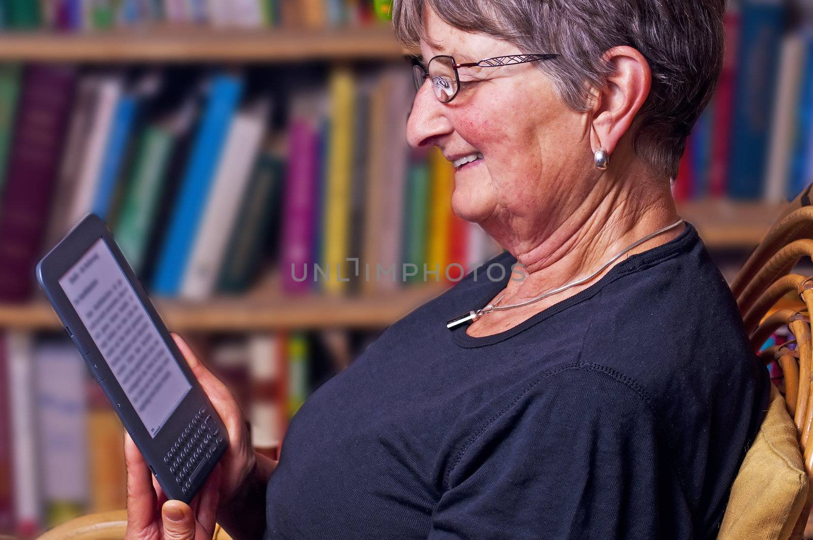 pensioner with e-book reader