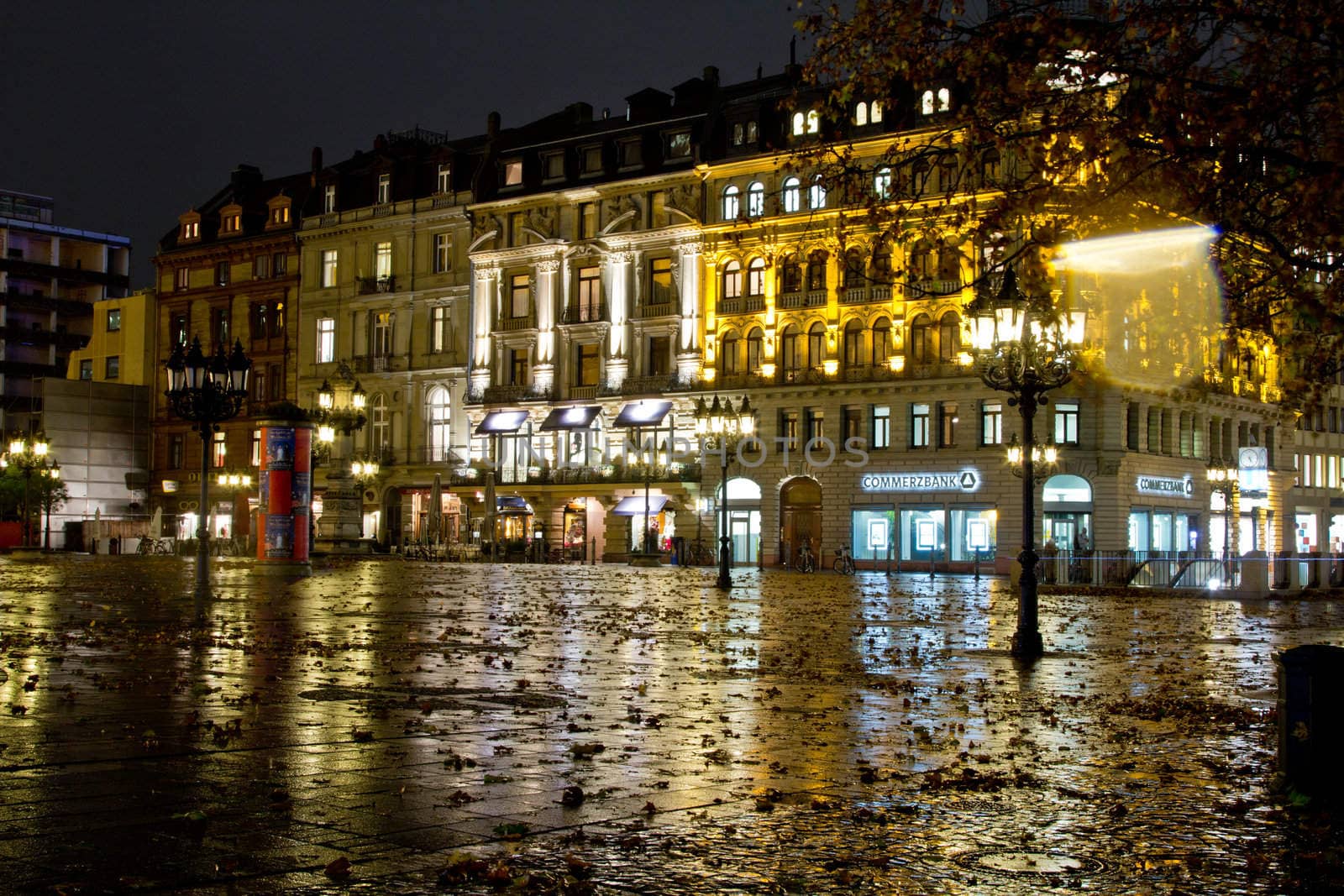 Reflection of buildings on a wet concrete floor in Frankfurt Germany