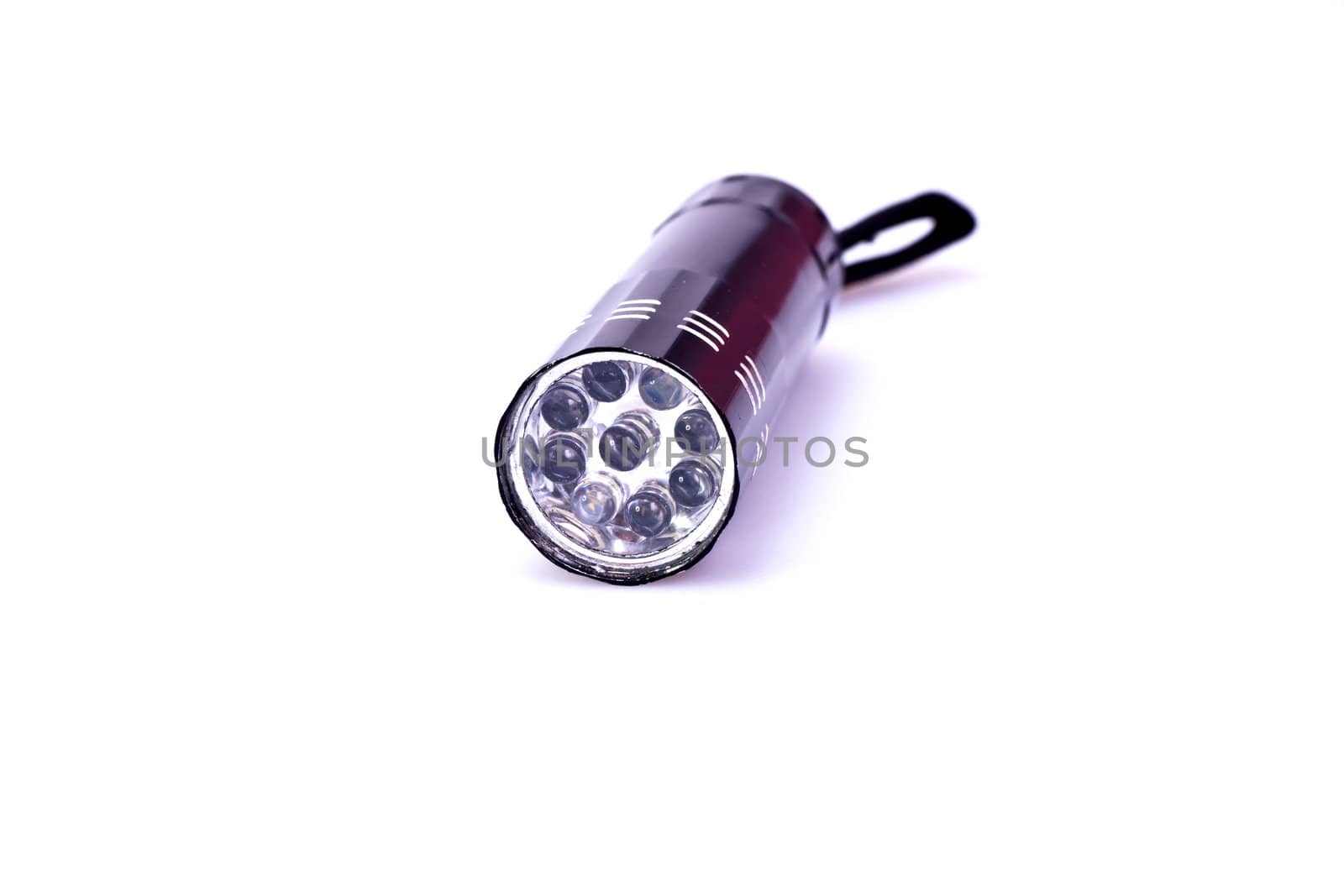 black LED torchlight on white background in close up view