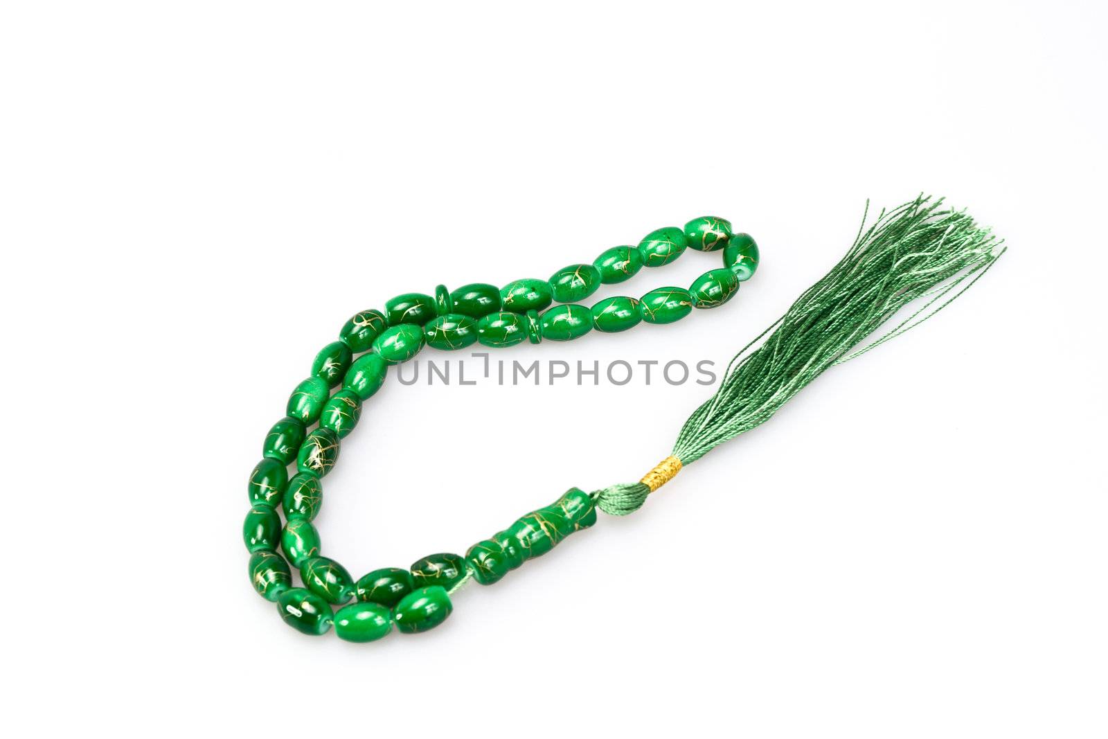 green rosary beads on white background
