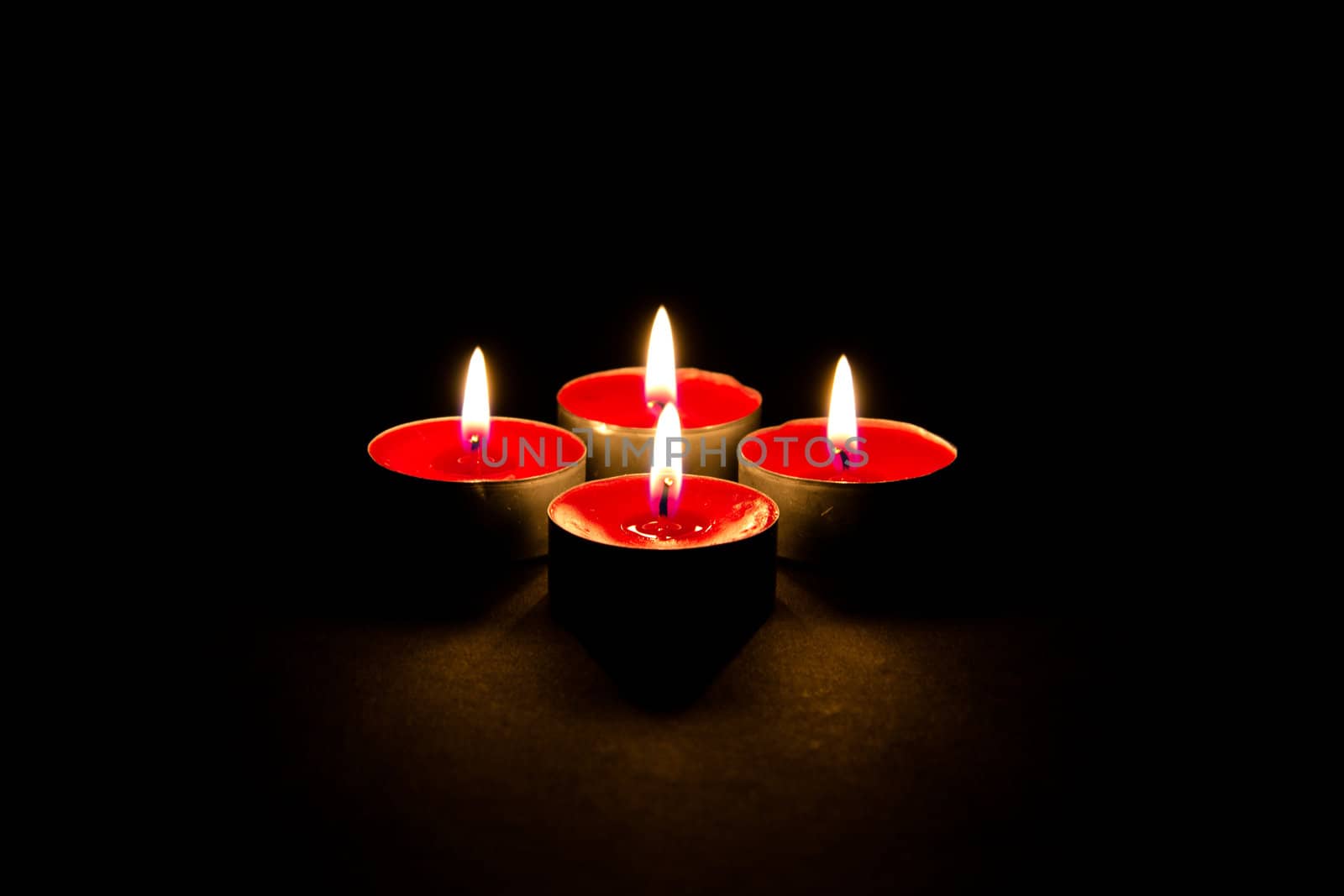 Red candles on a dark background