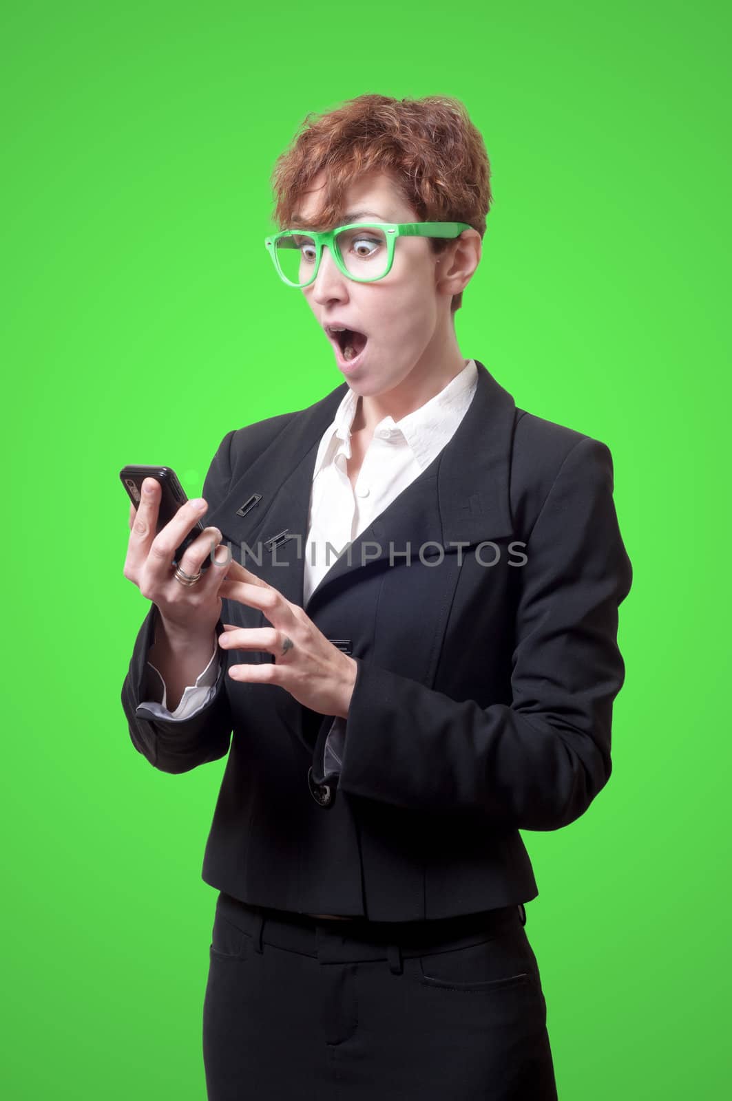 business woman calling on phone on green background