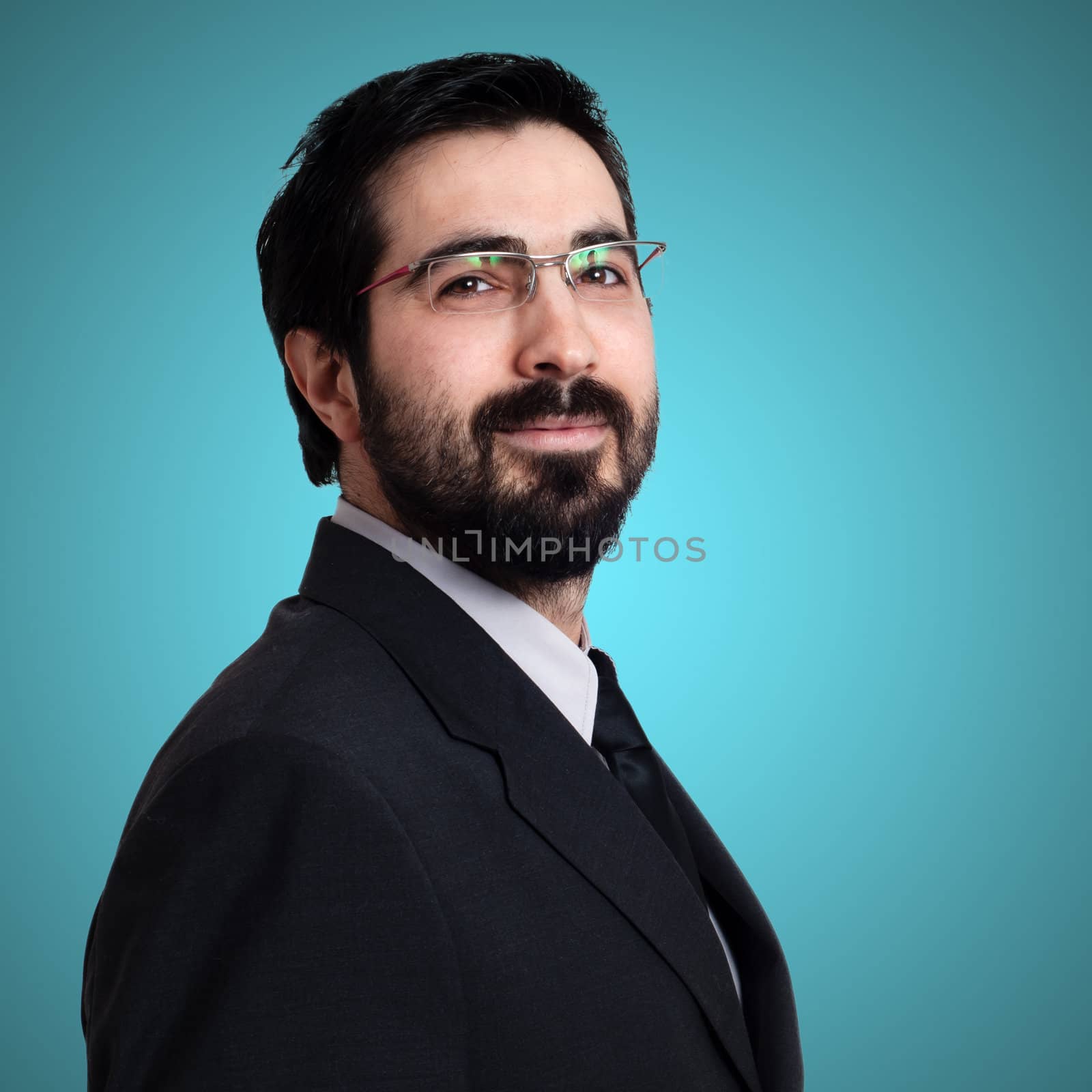 elegant bearded success business man on blue background