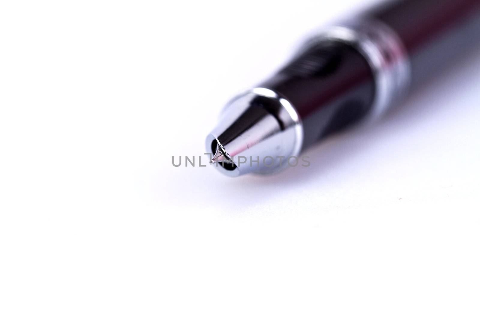 Close up view of a black fountain pen on white surface