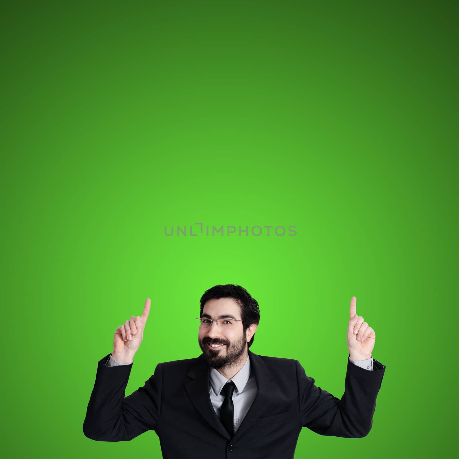 success business man pointing on green background