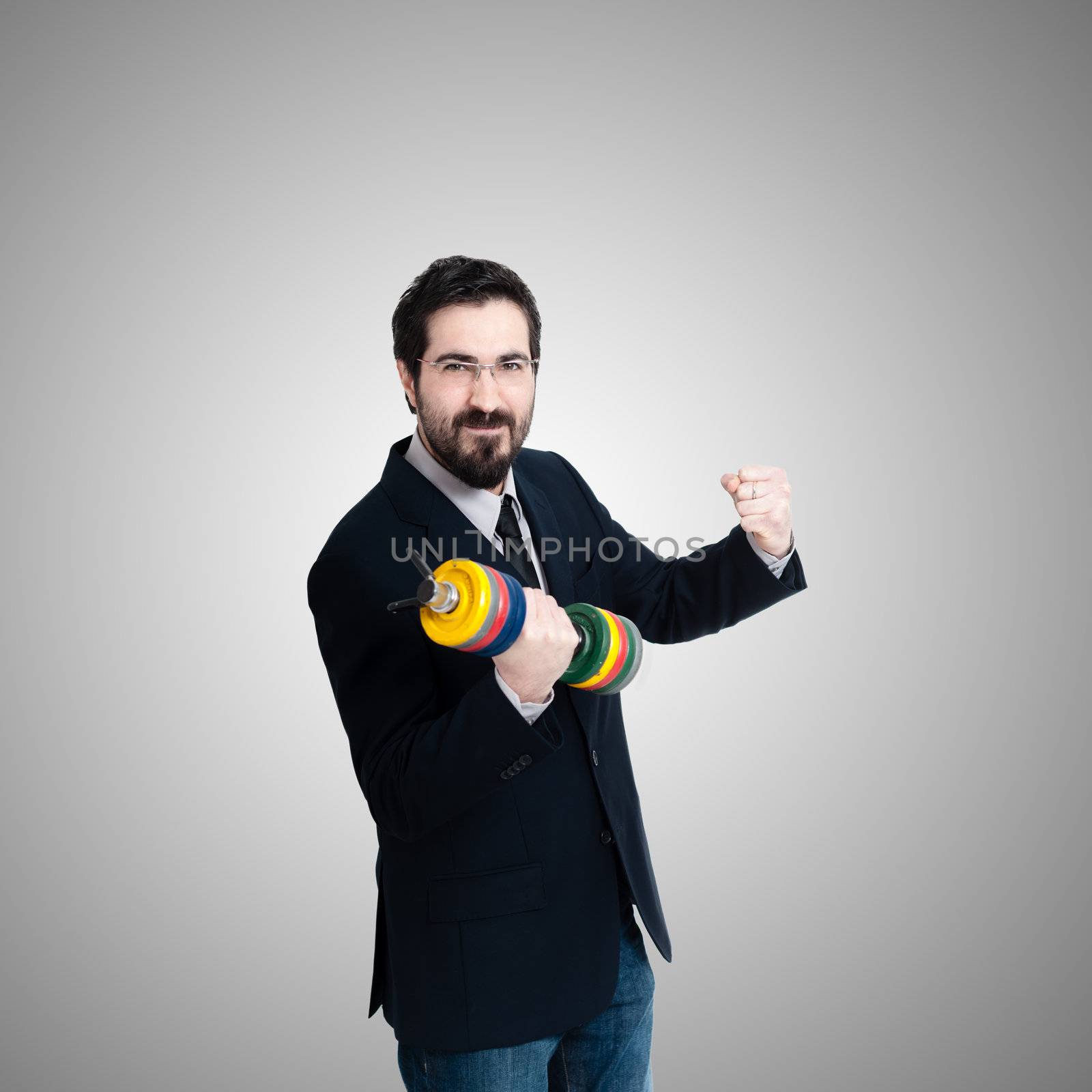 strong business man with weight gym on gray background