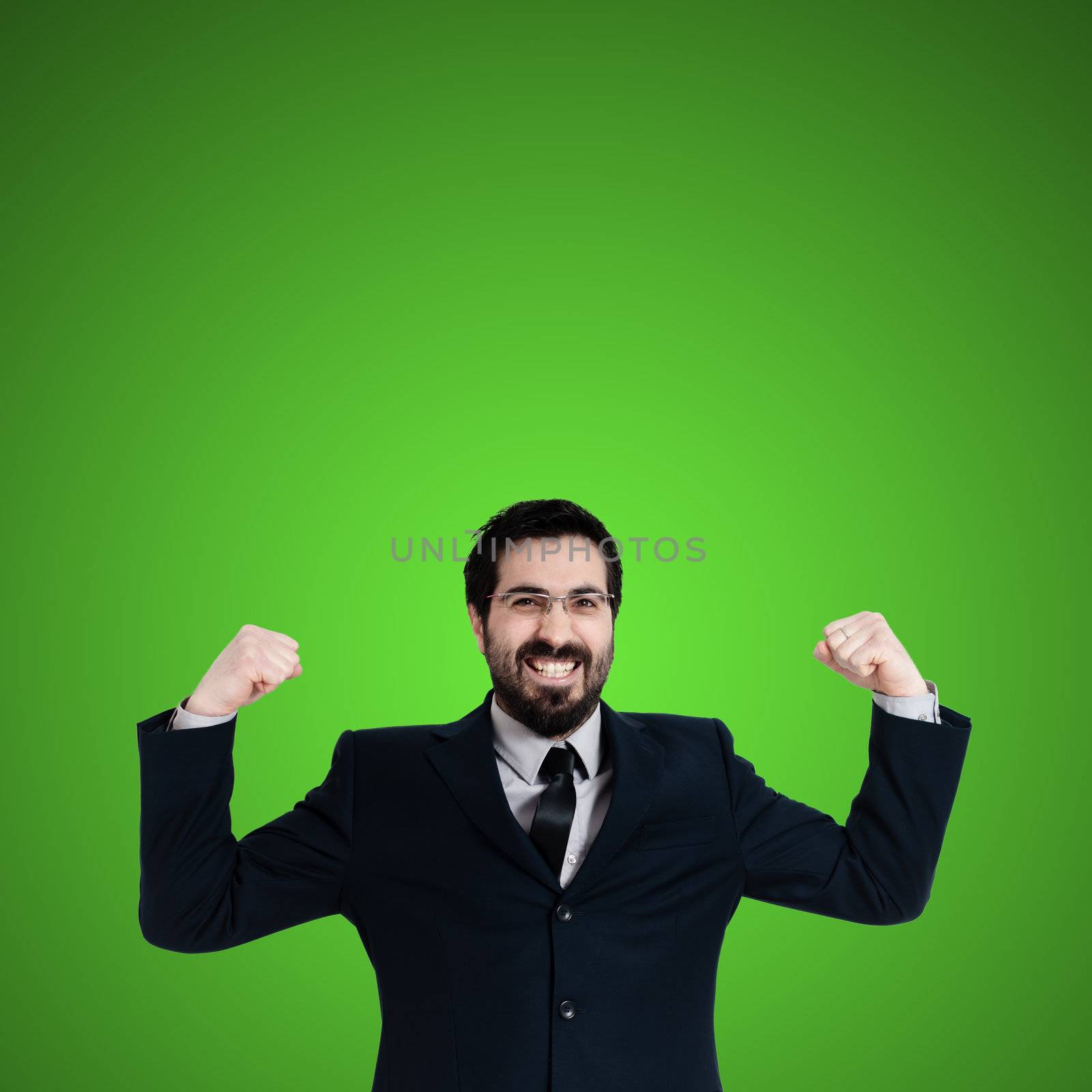 strong business man flexing muscle on green background