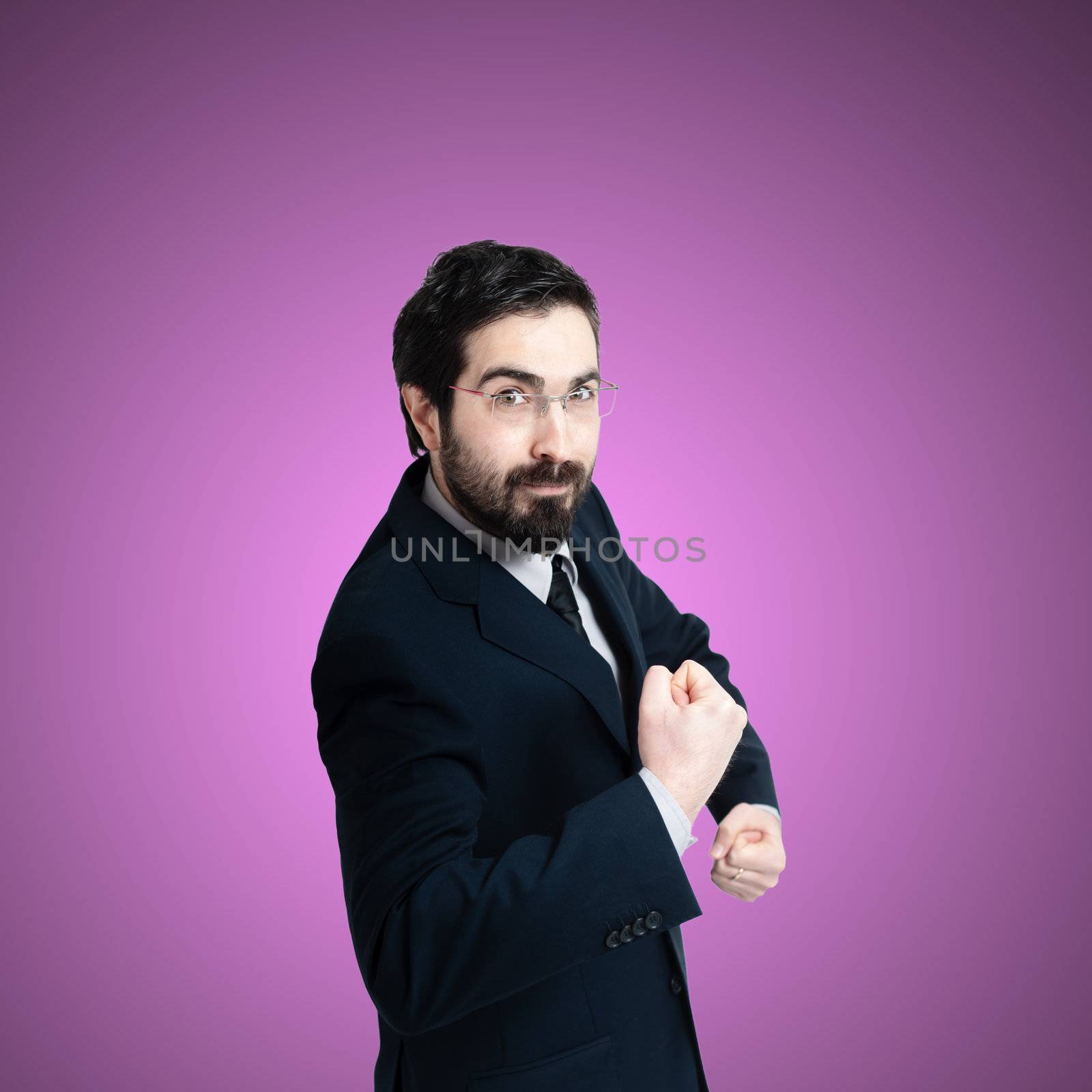 strong business man flexing muscle on pink background