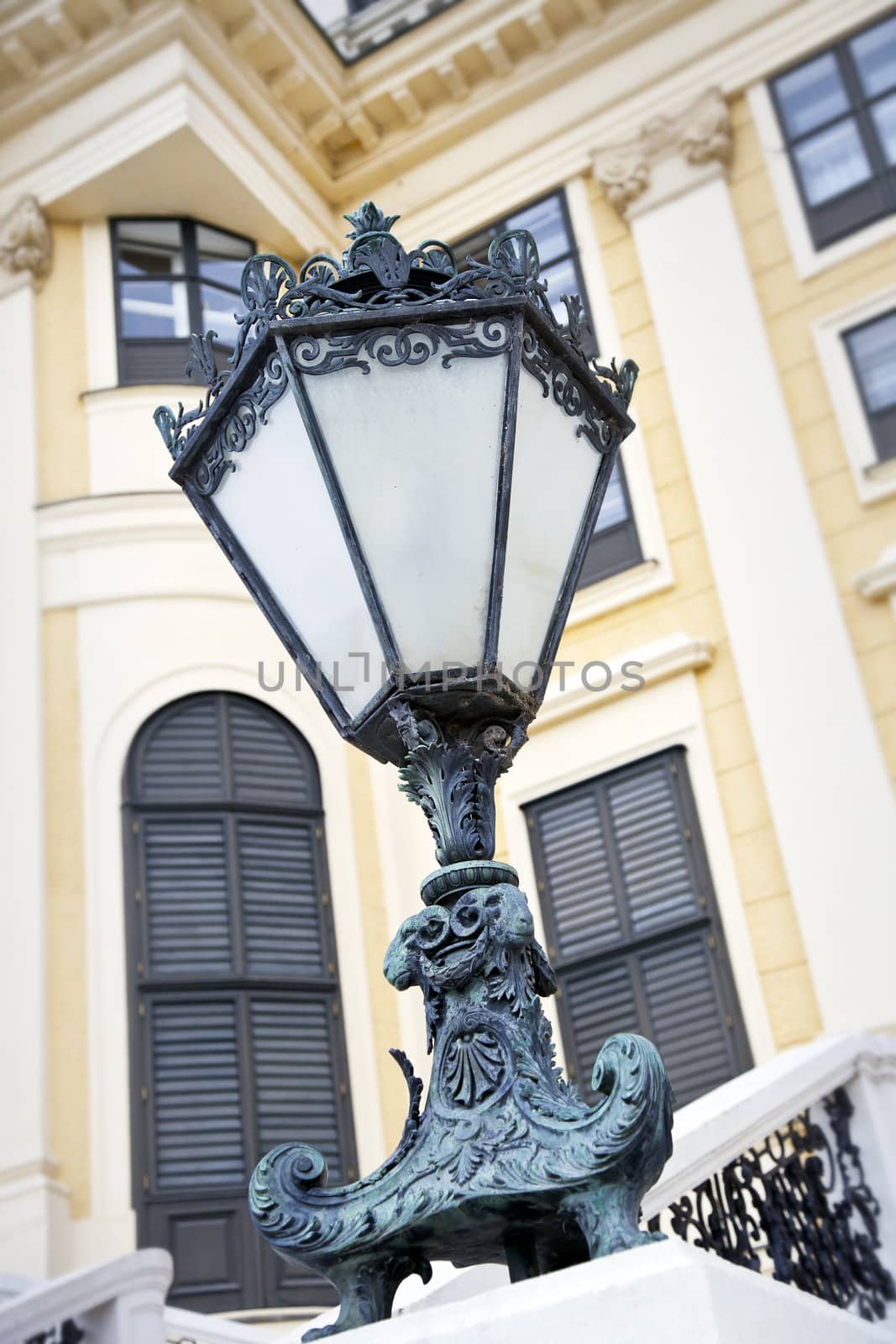 Decorative outdoor lamp with Schonbrunn palace in the background