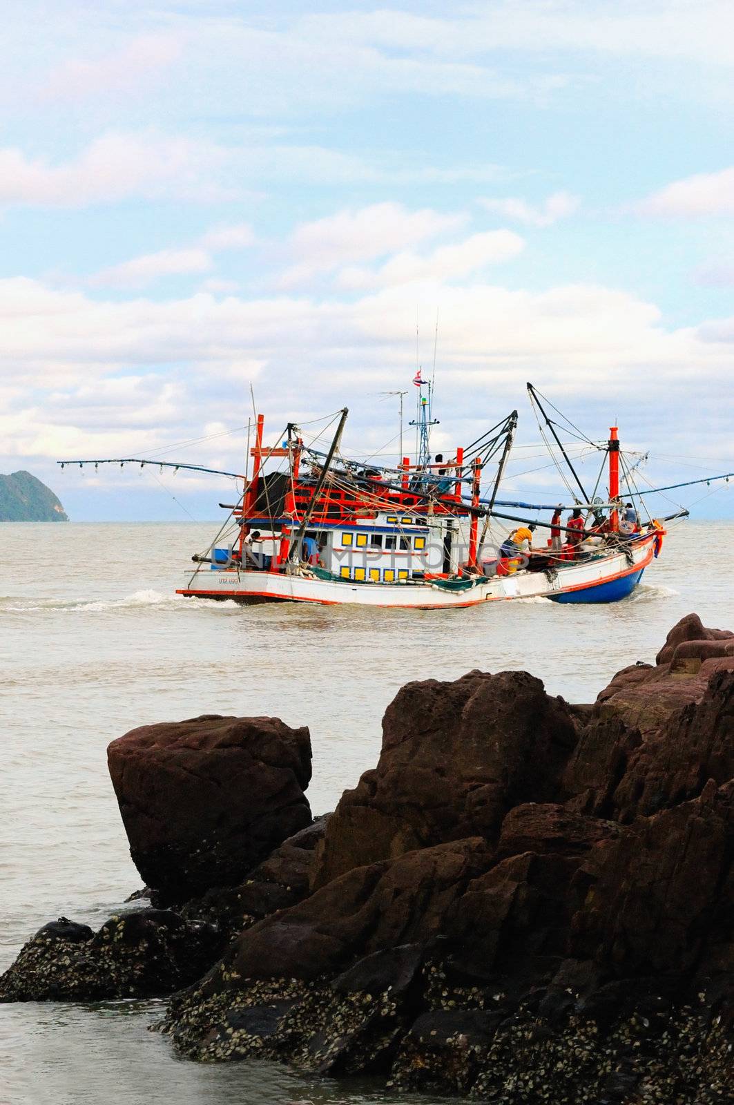 Fishing boats go to open sea, Thailand. by ngungfoto