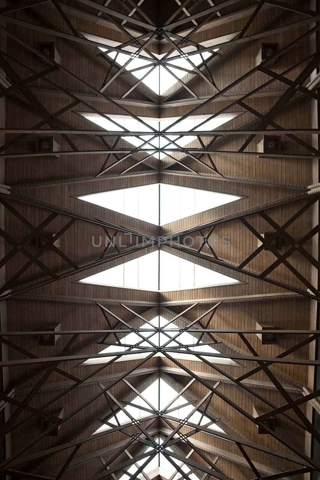 An abstract ceiling made of wood and glass