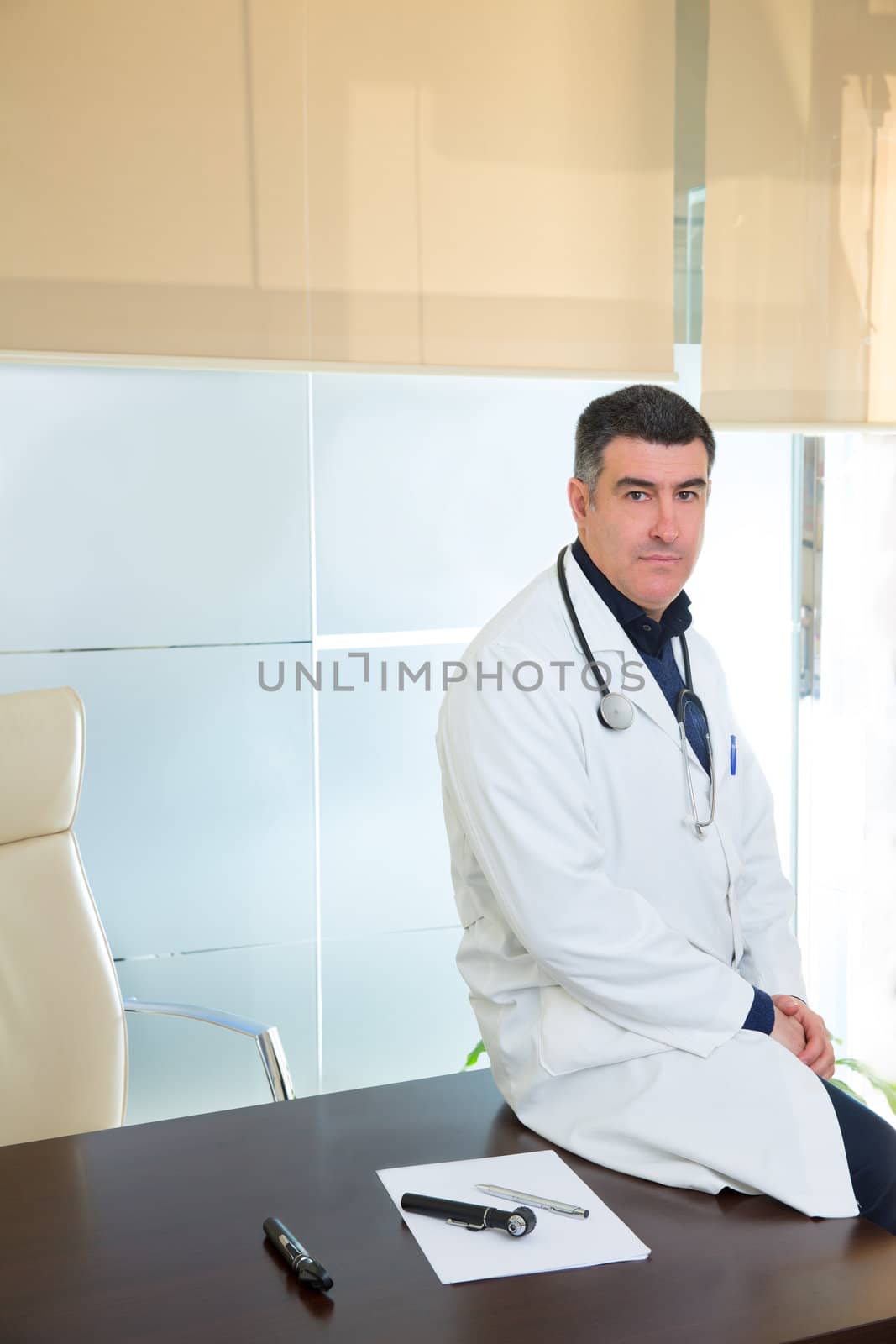 Doctor man expertise portrait casual sitting in hospital office by lunamarina