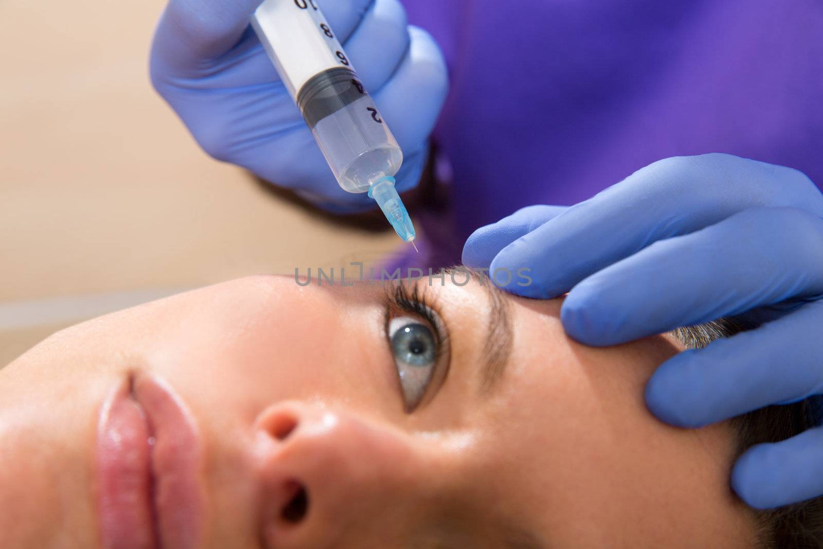 Anti aging facial mesotherapy with syringe closeup for face eye wrinkles