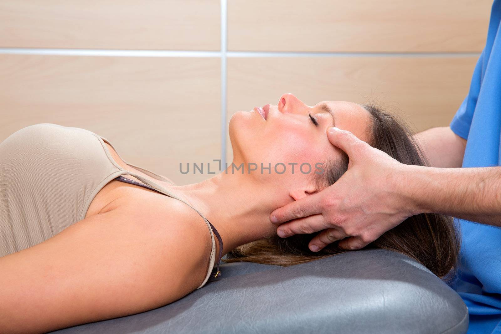 facial reflexology doctor hands in woman face therapy profile view