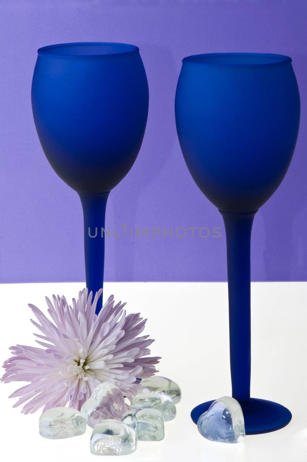 a couple of blue glasses of champagne