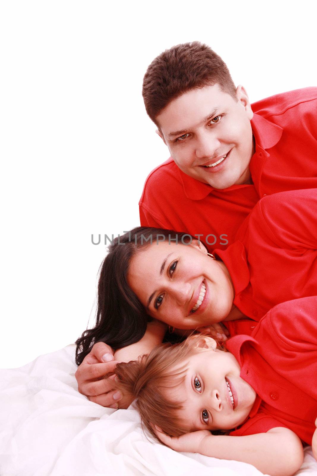 A family portrait of mom, dad and their daughter; isolated on the white background