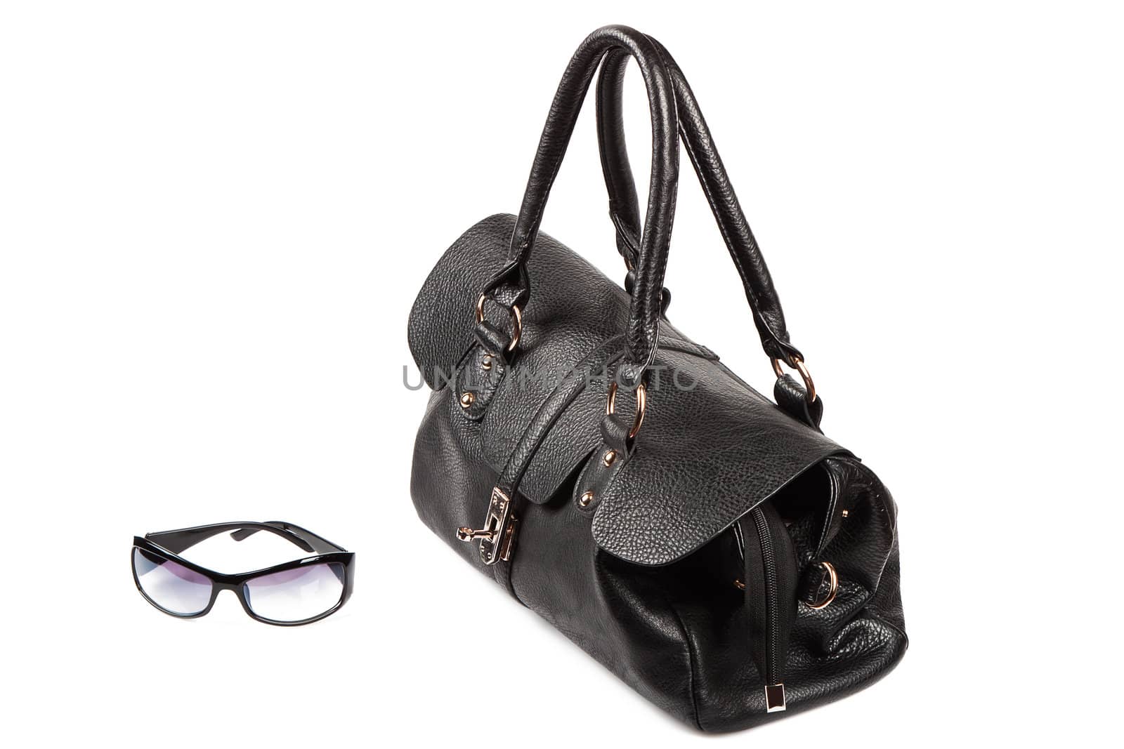 Black handbag and glasses isolated on the white background