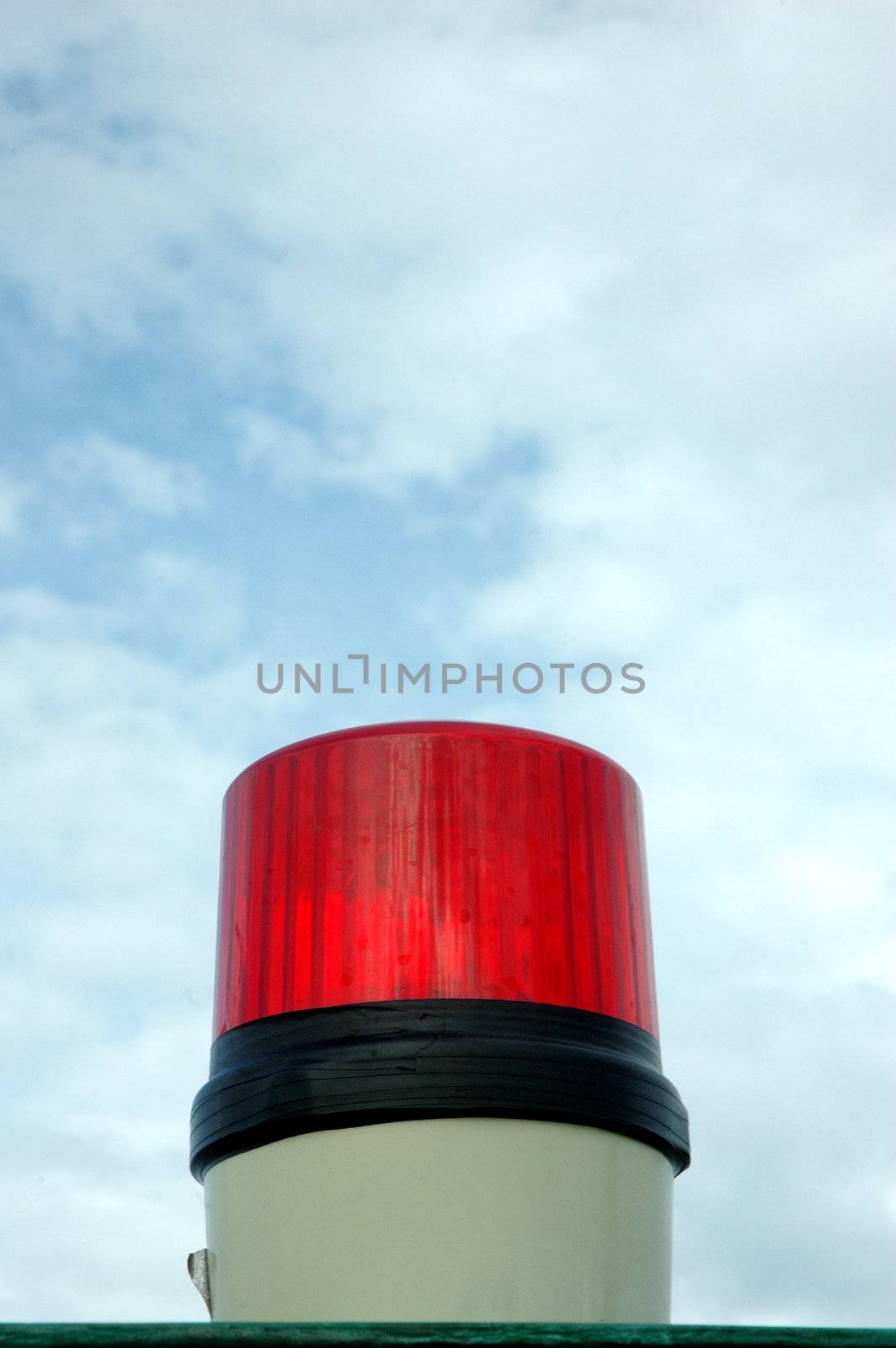 a red siren lights with blue sky background