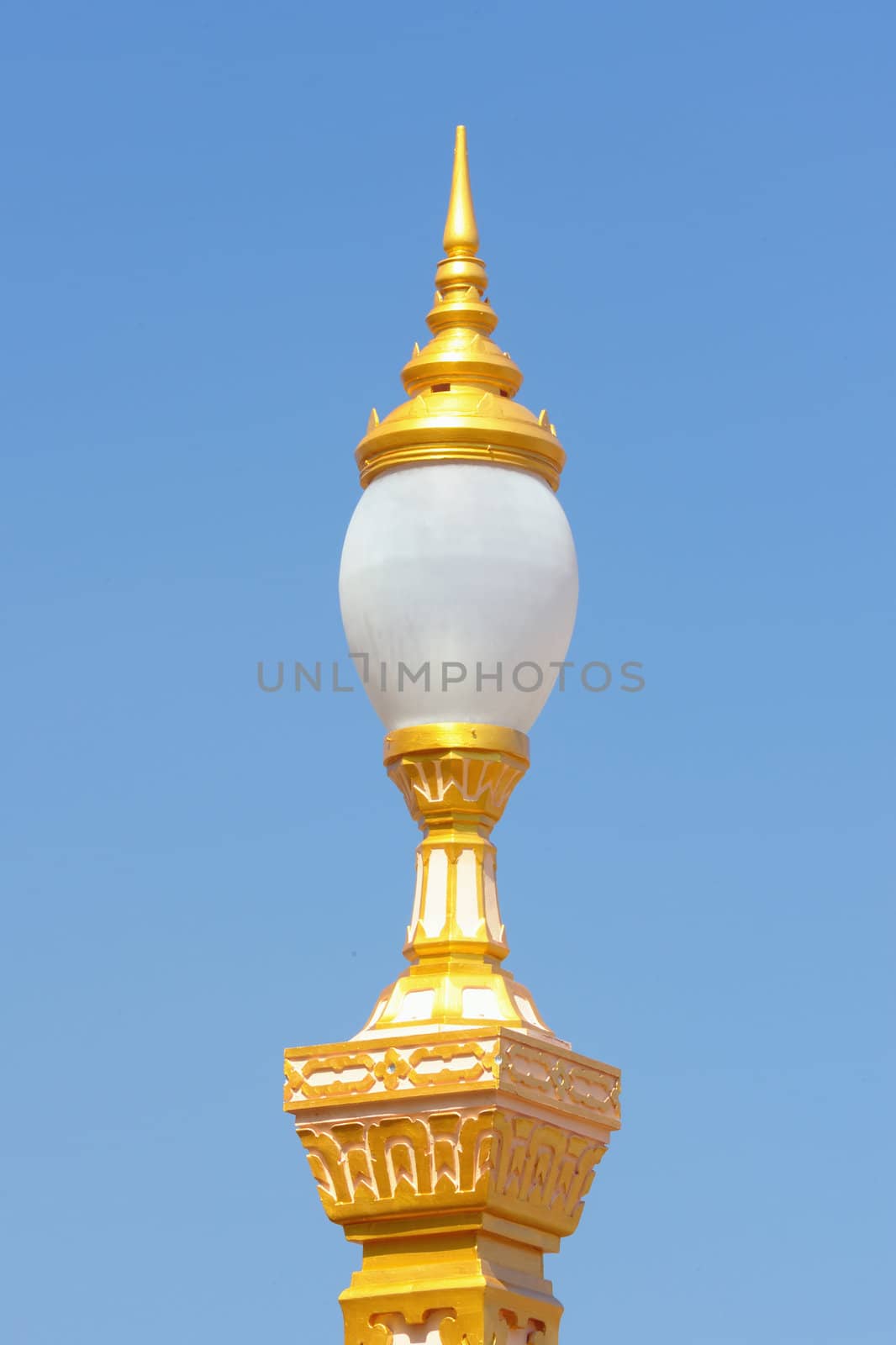 Thai antique lamp with blue sky.This vintage Thai styled for decorated in the park.