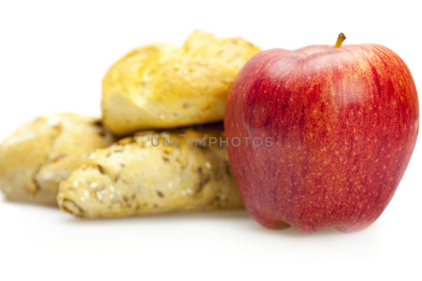 apple and bread isolated on white