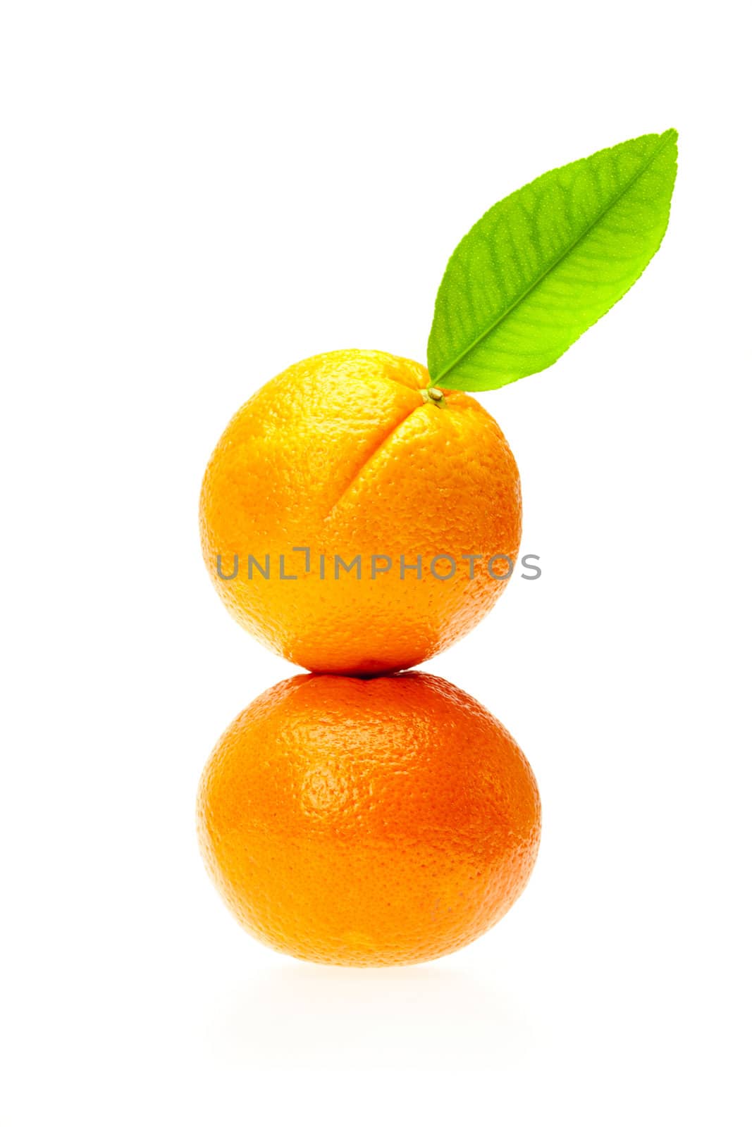 oranges with green leaf isolated on white