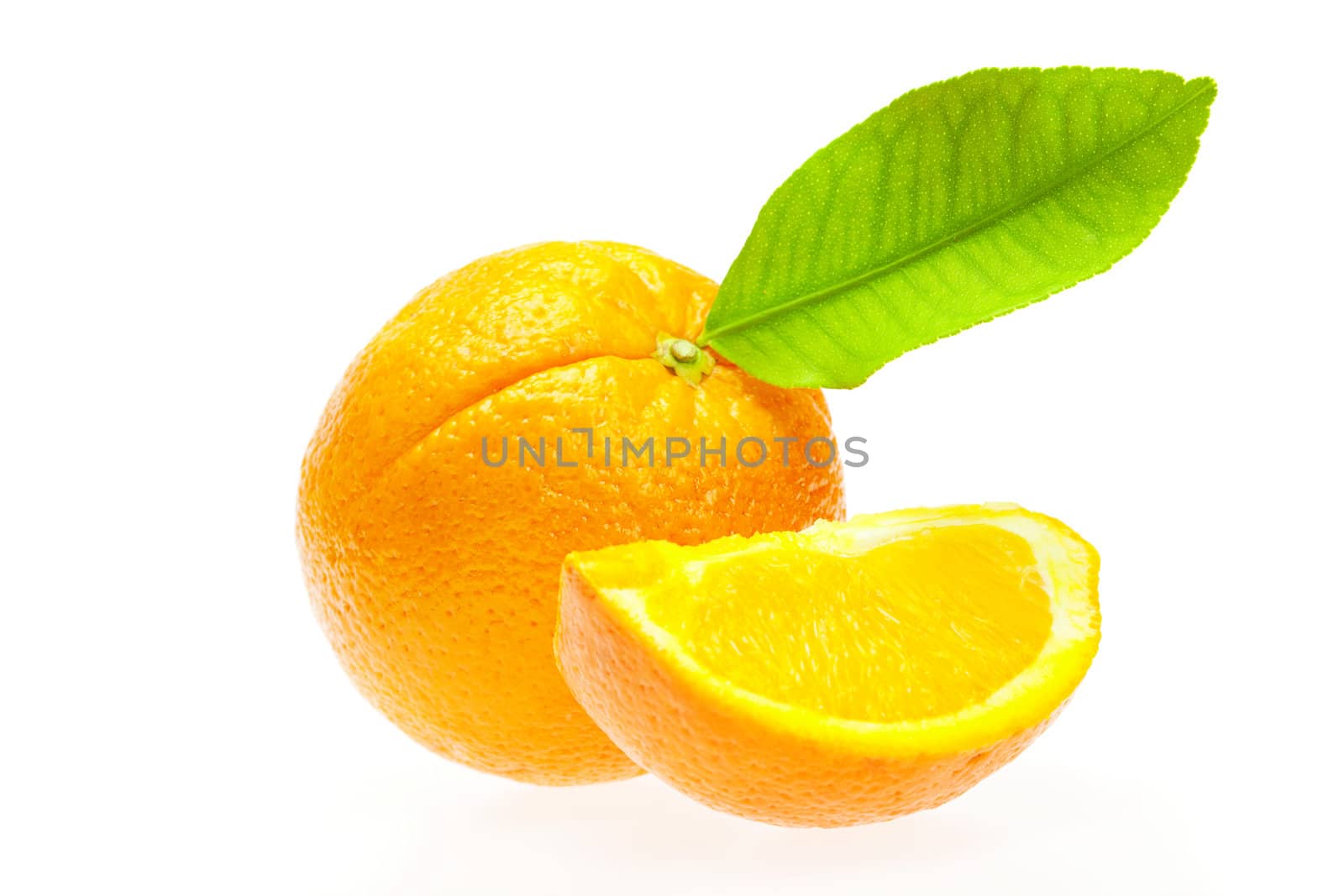 oranges with green leaf isolated on white