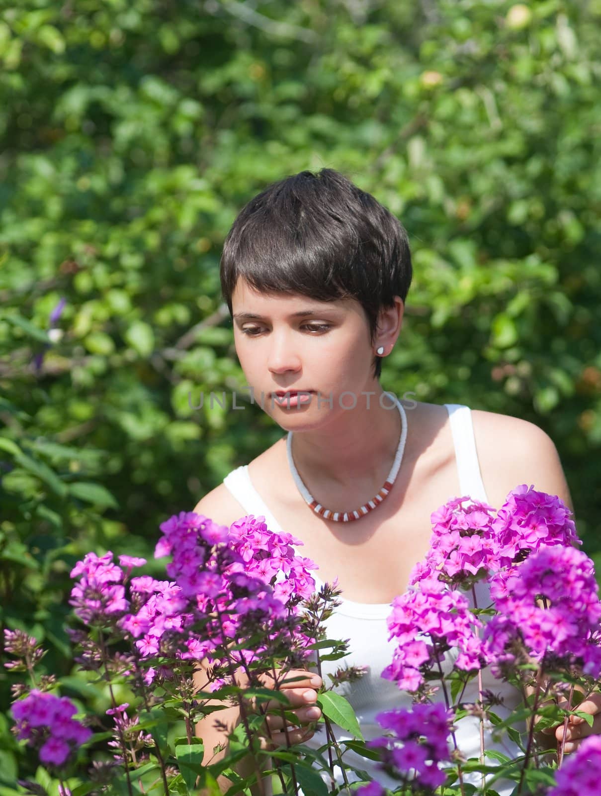 Beautiful girl with flowers by nikolpetr