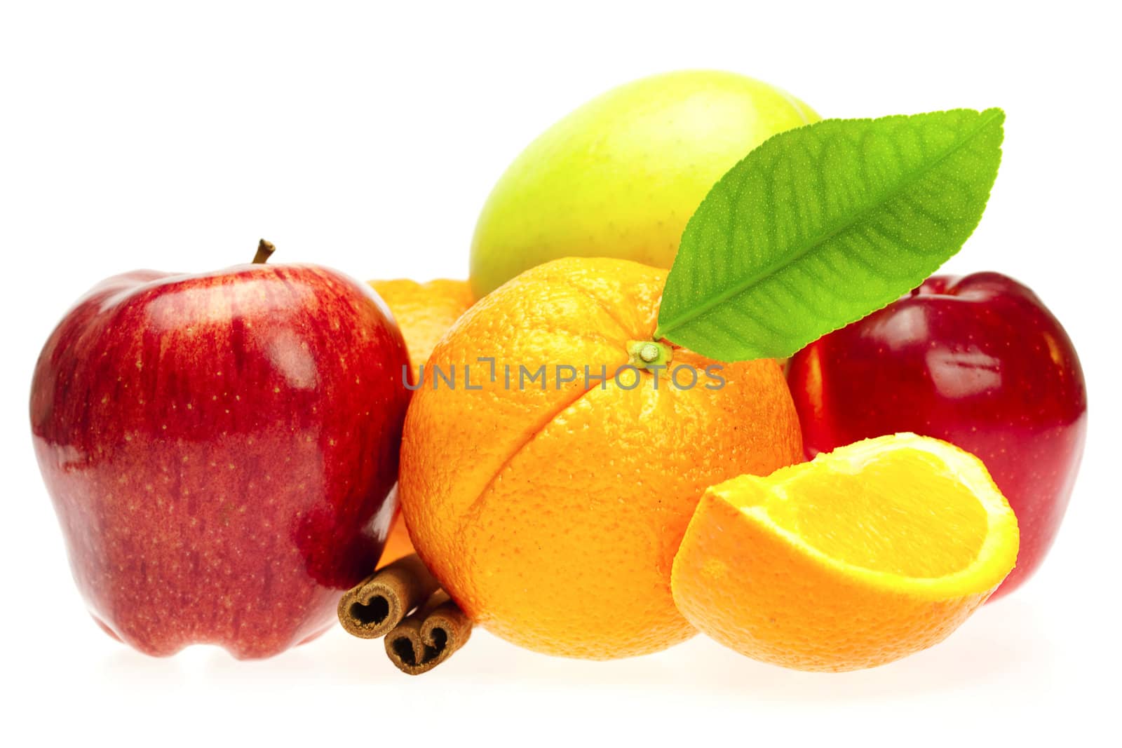 oranges, cinnamon sticks and apples  isolated on white